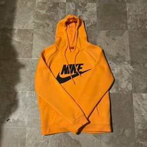 This is an orange hoodie that has never been worn